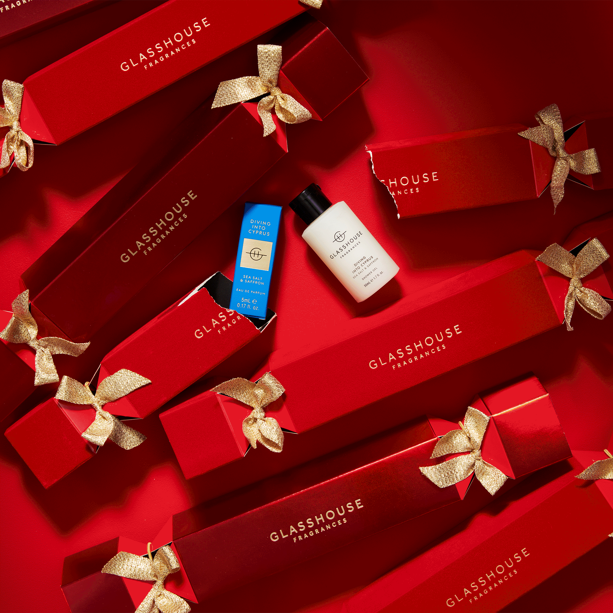 Glasshouse Fragrances animated red Christmas Bon Bons breaking to reveal Diving Into Cyprus 1.7oz Shower Gel and 0.17oz Eau de Parfum